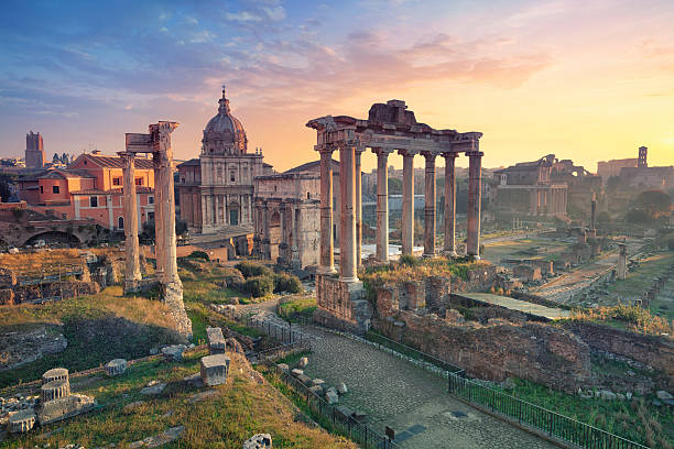 The Colosseum in Rome, Italy, bathed in warm sunset light.